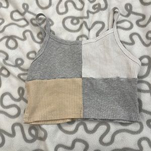 I’m selling this gray/white/tan colored cropped tank top